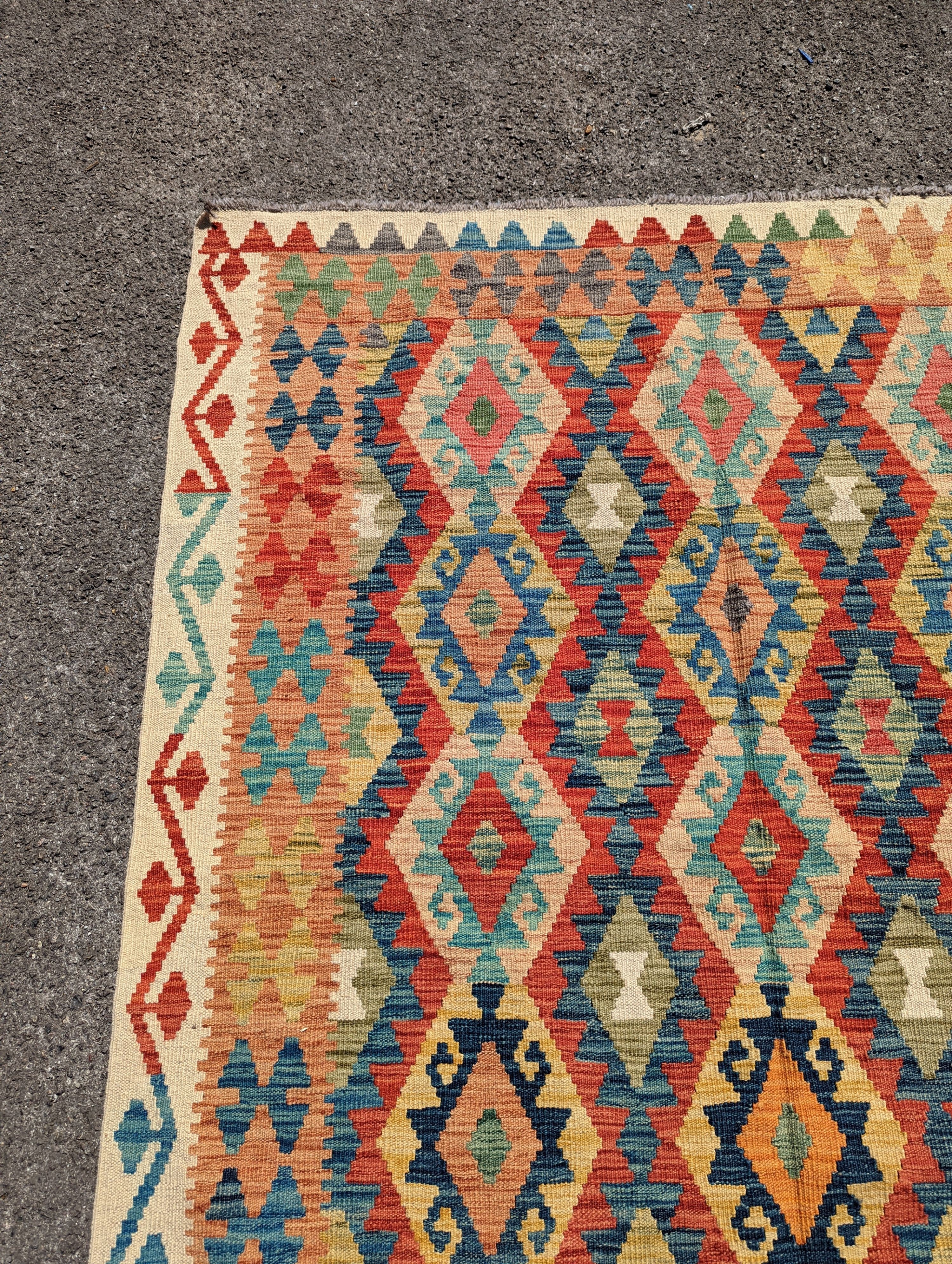 An Anatolian design polychrome geometric flatweave carpet, 196 x 156cm